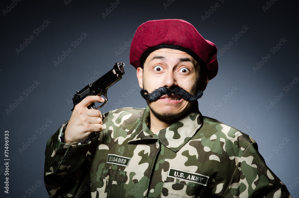 Funny soldier against the dark background Funny soldier against the dark background