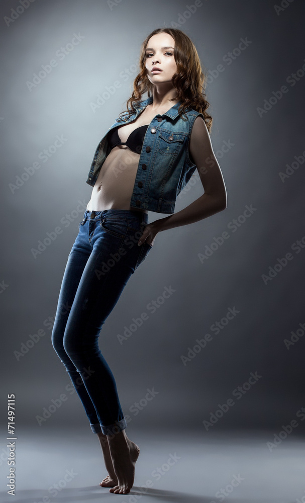 Beautiful jeanswear model posing at camera Beautiful jeanswear model posing at camera