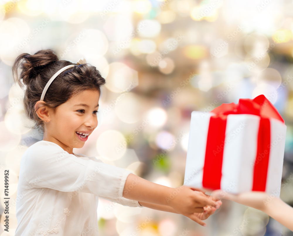 smiling little girl with gift box smiling little girl with gift box