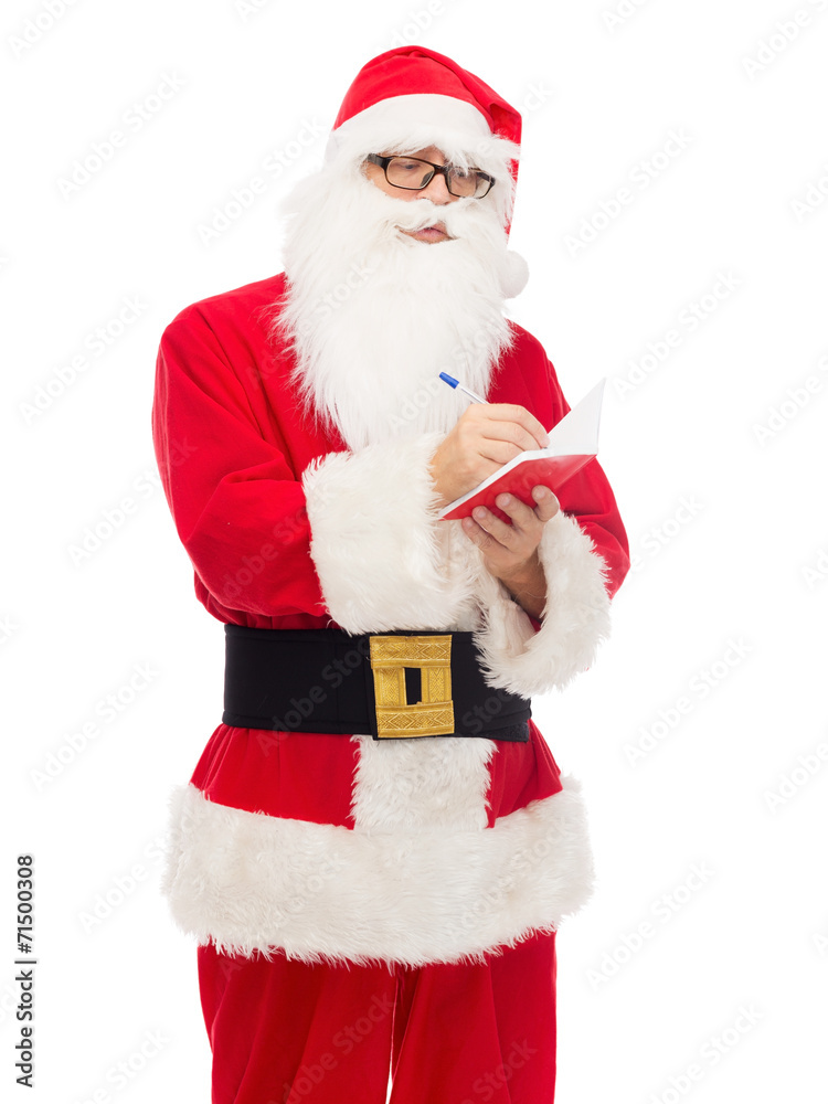man in costume of santa claus with notepad man in costume of santa claus with notepad