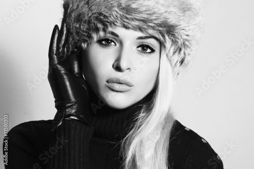 Monochrome portrait.Young Woman in Fur Hat.Black Leather Gloves
