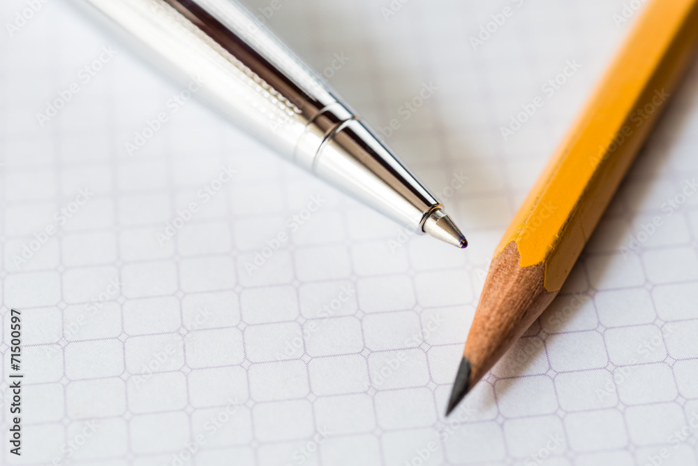 Pen and pencil on the notebook closeup Pen and pencil on the notebook closeup