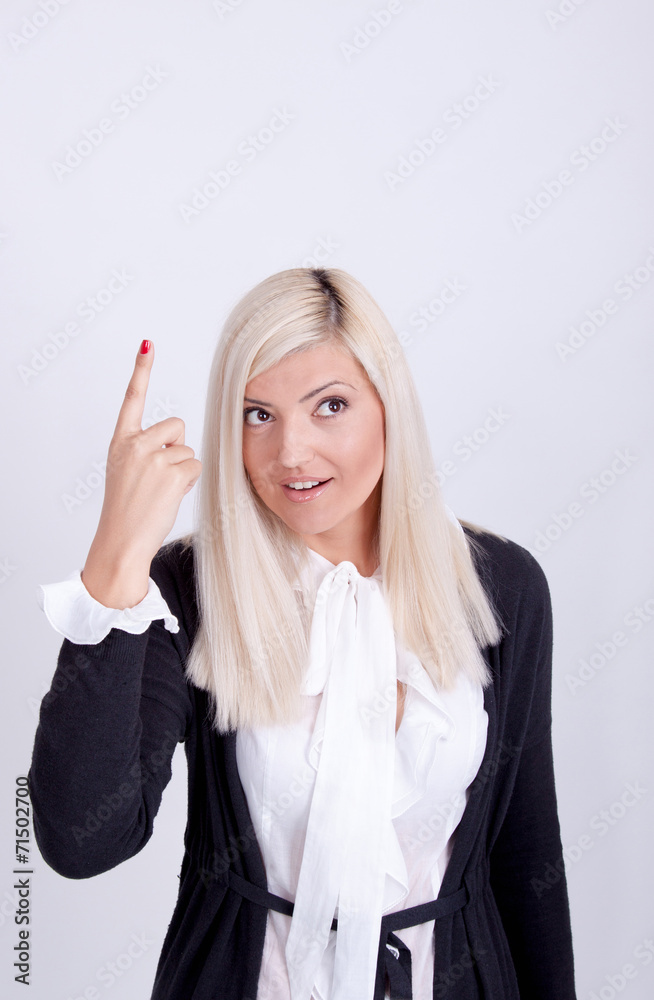 Portrait of casual dressed blond woman posing with arms crossed Portrait of casual dressed blond woman posing with arms crossed