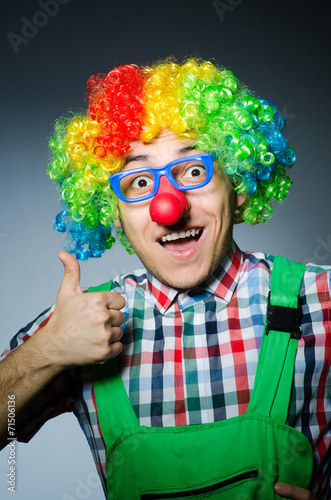 Funny clown against the dark background