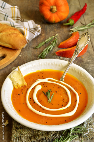 Pumpkin creamy soup with rosemary.