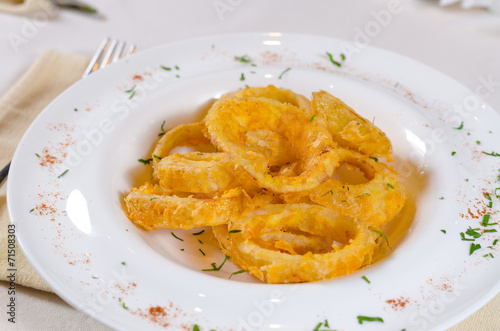 Bowl of Onion Rings at Fancy Table Setting