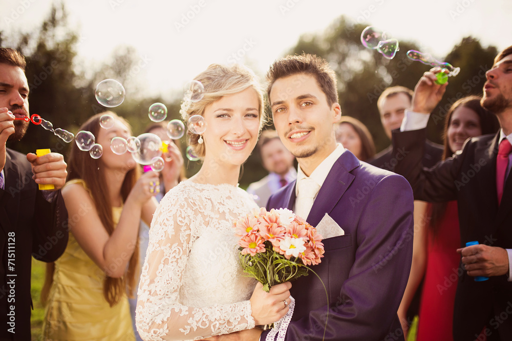 Newlyweds at wedding reception - obrazy, fototapety, plakaty 