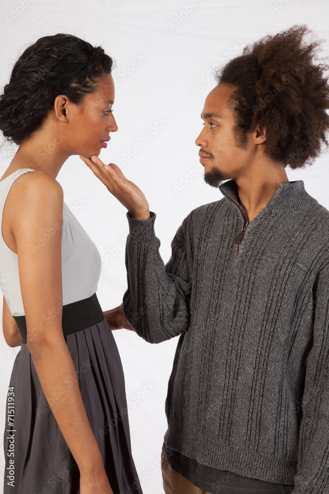 Romantic black couple, male and female, touching Romantic black couple, male and female, touching