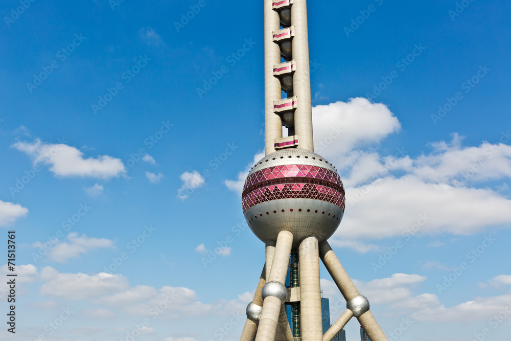 Obraz premium Shanghai Oriental pearl TV tower under the blue sky.
