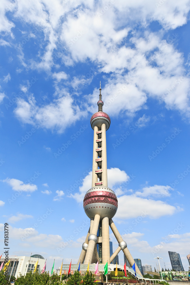 Obraz premium Shanghai Oriental pearl TV tower under the blue sky.