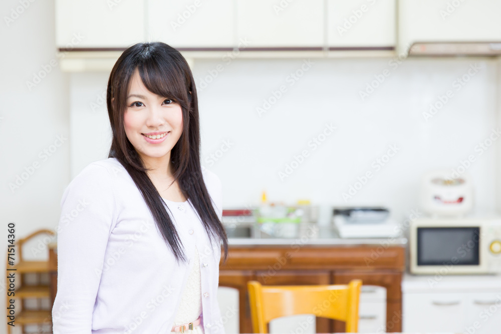 young asian women relaxing in the kitchen