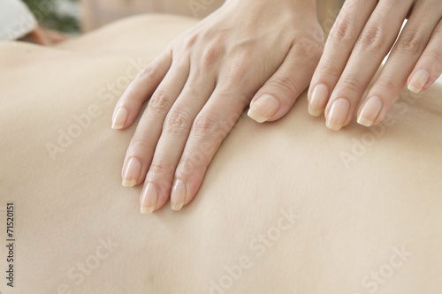 Estheticians massage the back