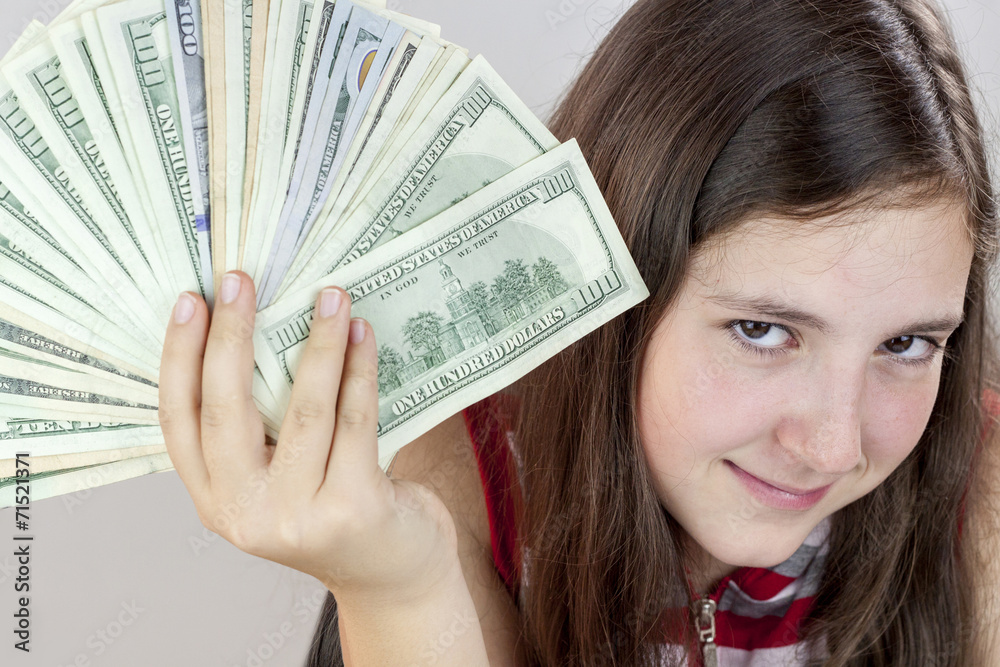 Beautiful teen girl holding US dollars Beautiful teen girl holding US dollars