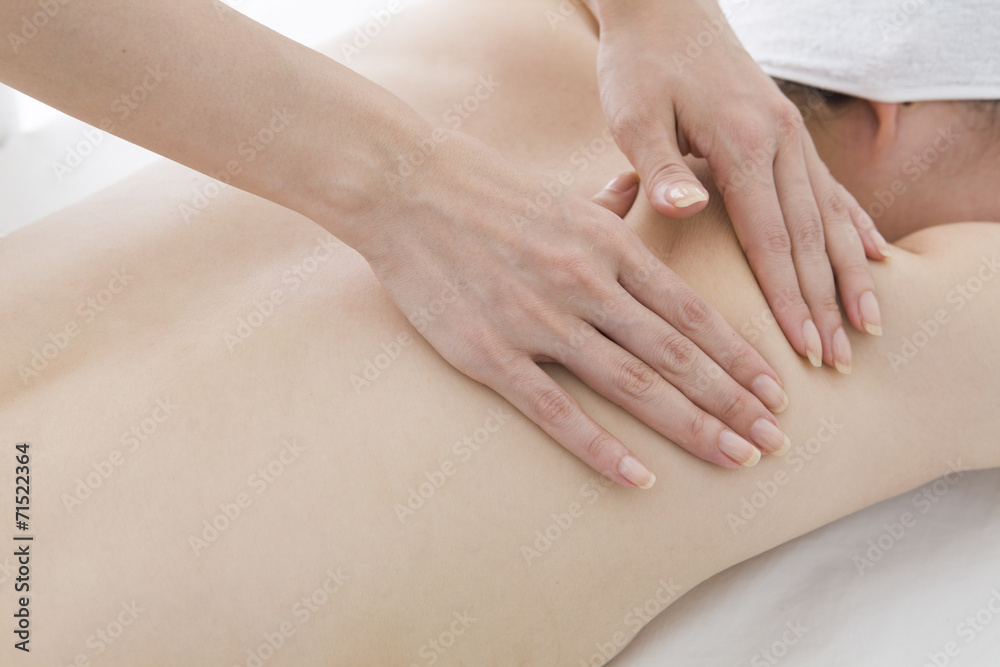 Masseuse relax the muscles of the back Masseuse relax the muscles of the back