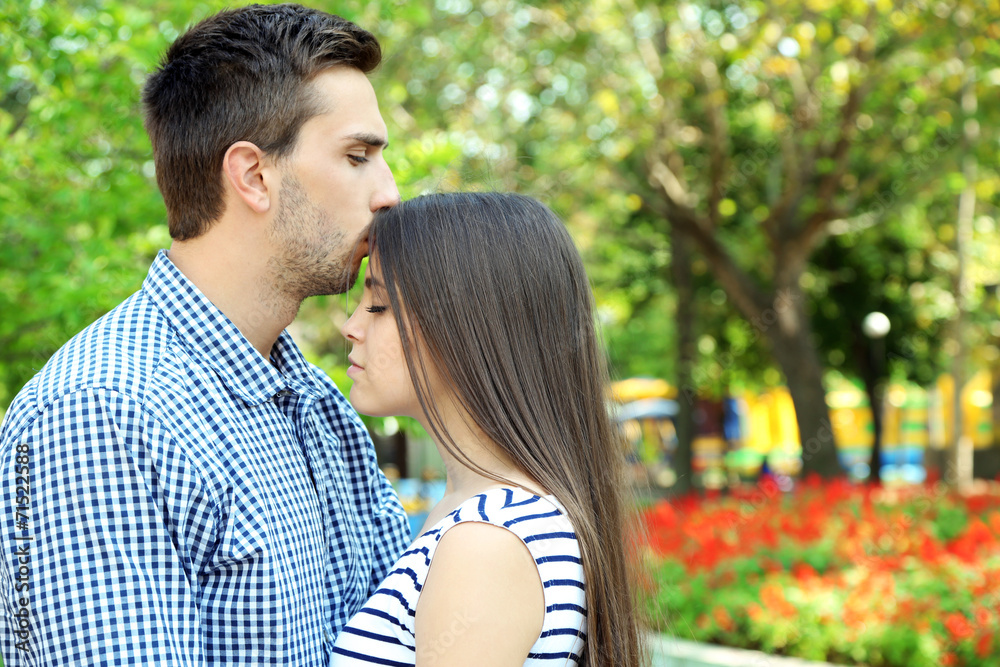 Embrace a loving couple outdoors