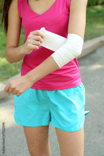 Sports injuries of girl outdoors