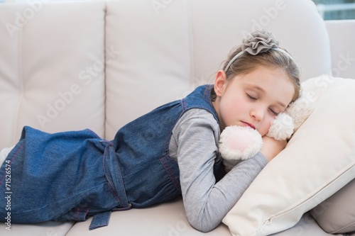 Little girl napping on the couch