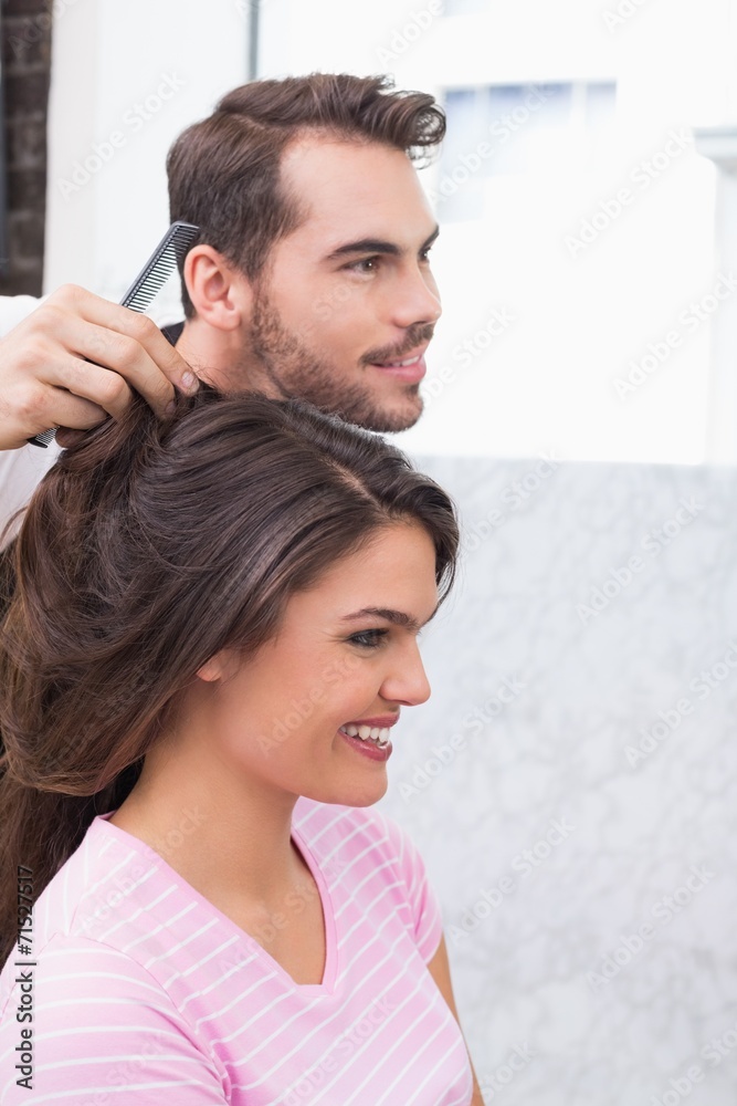Fototapeta premium Handsome hair stylist with client