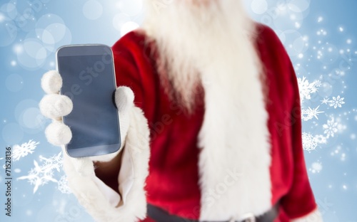 Composite image of santa claus showing smartphone