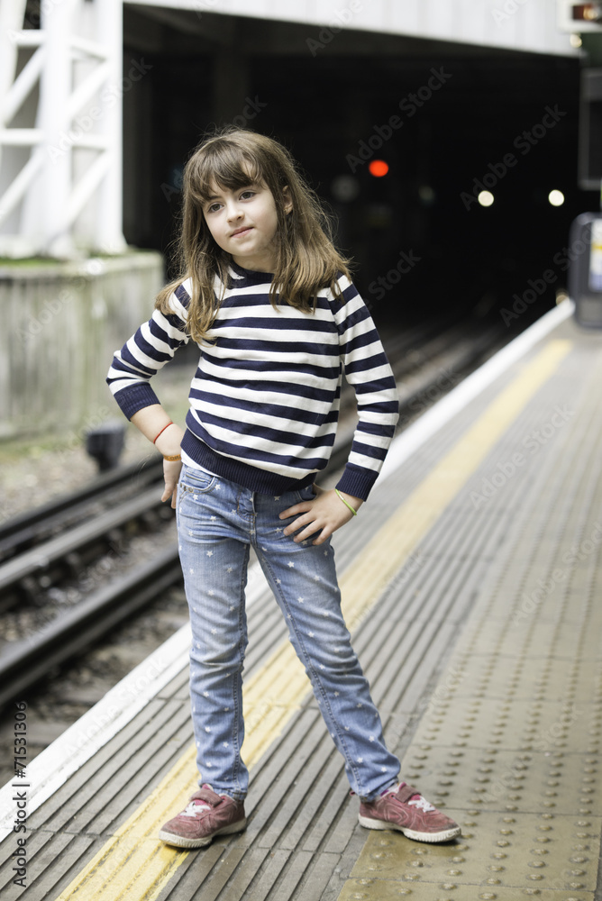 Little girl waiting the train