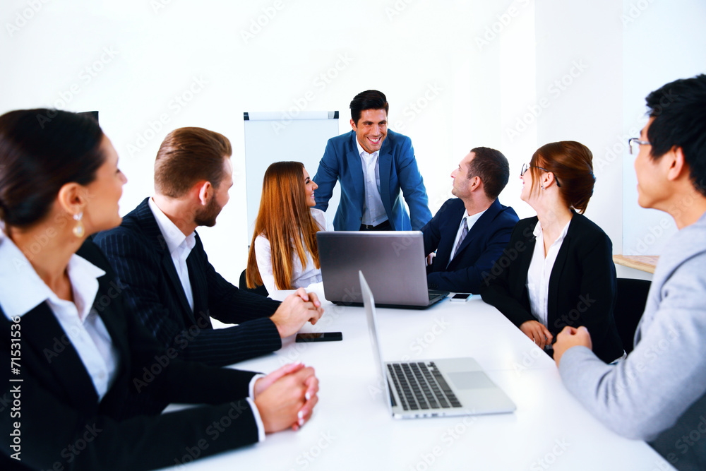 Businesspeople sitting at the table on a meeting Businesspeople sitting at the table on a meeting