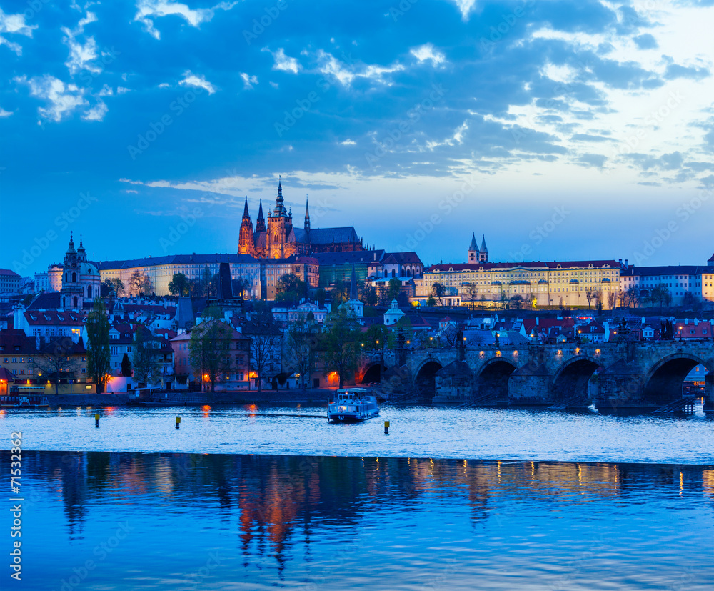 View of Charles Bridge and Prague Castle in dusk