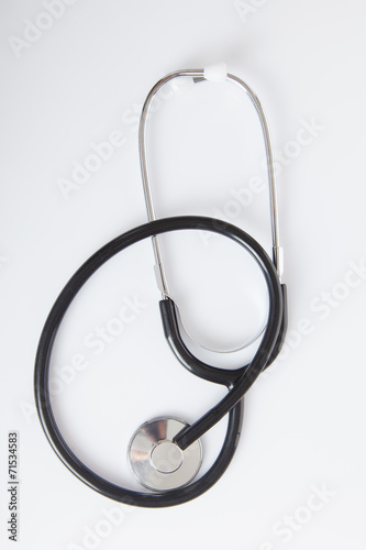 Black Stethoscope on white glossy table