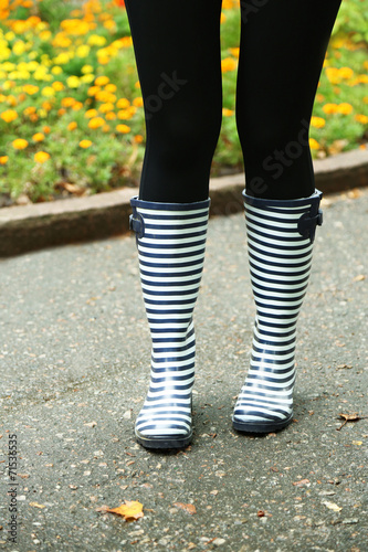 Woman in Boots on rainy autumn day. © Africa Studio