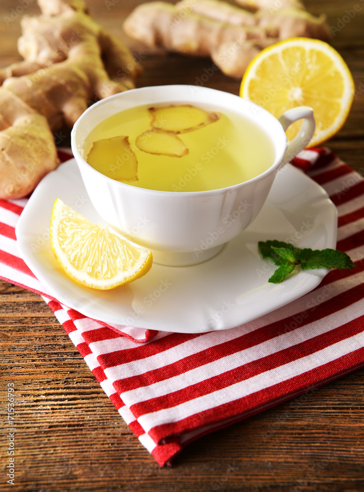Ginger tea with lemon on table close-up Ginger tea with lemon on table close-up