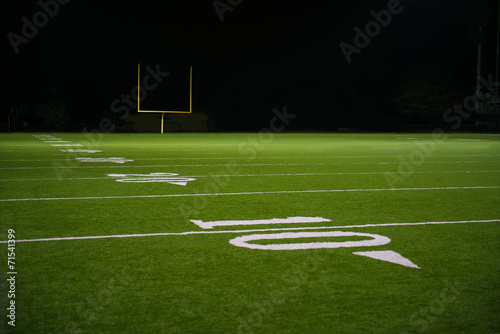 Fotografie Yard Numbers and Line on American Football Field