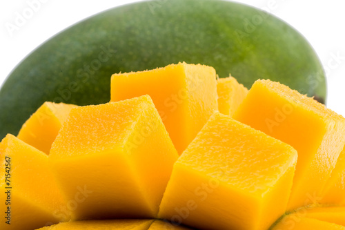 Fresh hainan mango / slices close up isolated on white / Macro