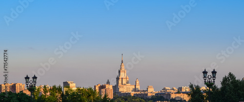 Summer panorama of the city at sunset