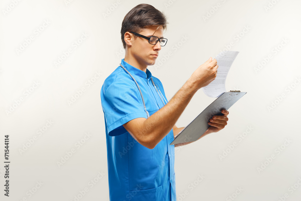 Doctor With Stethoscope Around his Neck Against Grey Background Doctor With Stethoscope Around his Neck Against Grey Background