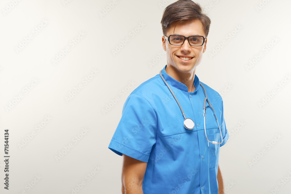 Doctor With Stethoscope Around his Neck Against Grey Background Doctor With Stethoscope Around his Neck Against Grey Background