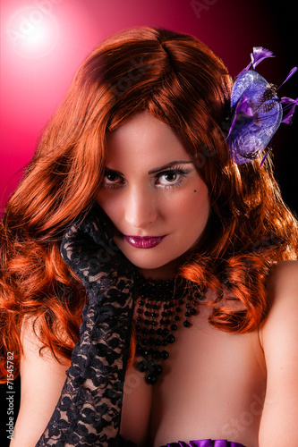 Beautiful young burlesque showgirl with piercing eyes. photo