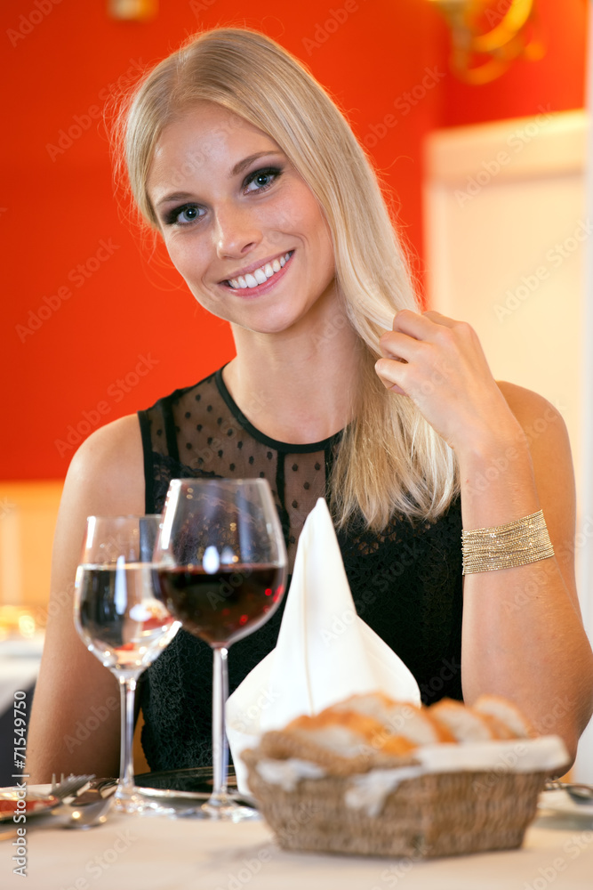 Smiling Woman at Table Having Bread and Wine. Smiling Woman at Table Having Bread and Wine.