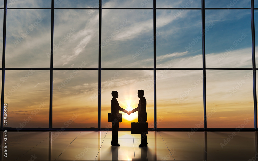 Two Business shake hand silhouettes Two Business shake hand silhouettes