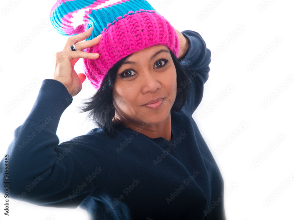 middle-aged asian woman wearing a colorful winter cap middle-aged asian woman wearing a colorful winter cap