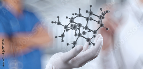 scientist doctor hand holds virtual molecular structure in the l