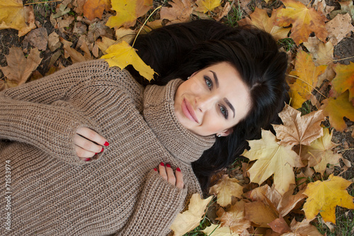 portrait of beautiful girl on yellow leaves. Outdoor