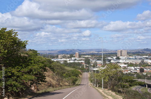 Empty Asphalt  Road Leading into Industrial Landscape