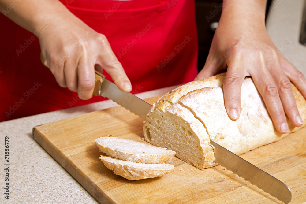 woman cutting bread