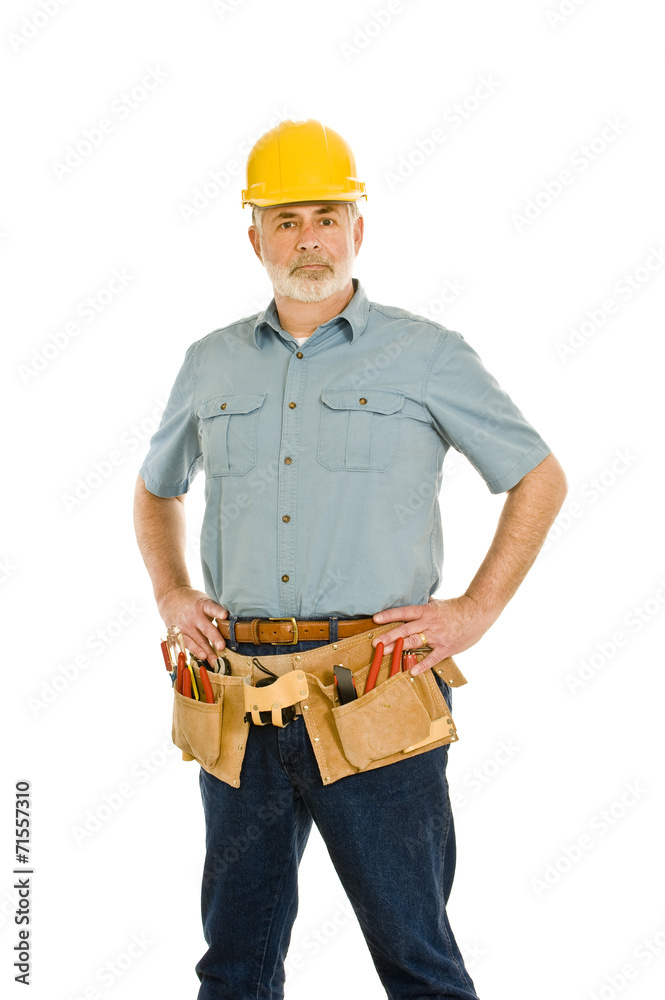 Middle-aged Repairman With Tool Belt and Hard Hat Middle-aged Repairman With Tool Belt and Hard Hat