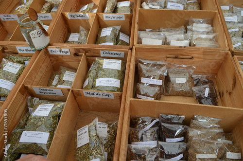boxes with medicinal herbs on market