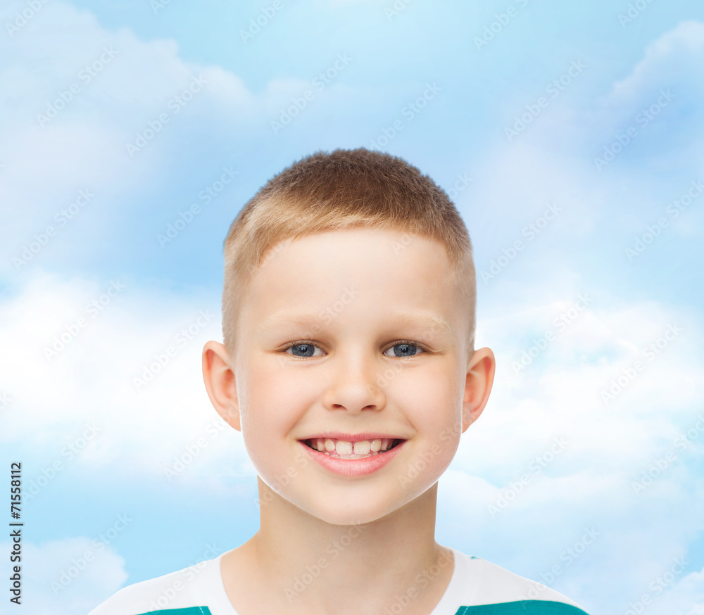 smiling little boy over green background smiling little boy over green background