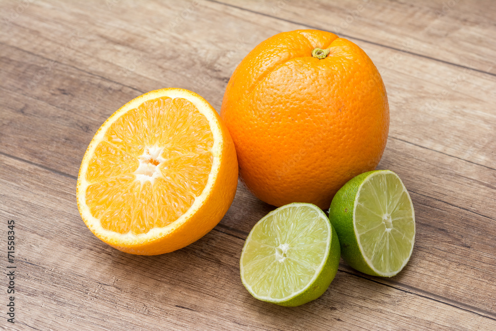 Orange And Lime Citrus Fruits On Wood Table Orange And Lime Citrus Fruits On Wood Table
