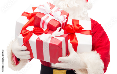 close up of santa claus with gift boxes