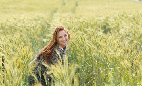 happy beautiful smiling young woman in the autumn field © Nastassia Yakushevic