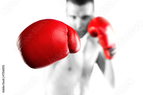 Black and white fighter with red gloves. Bokeh.