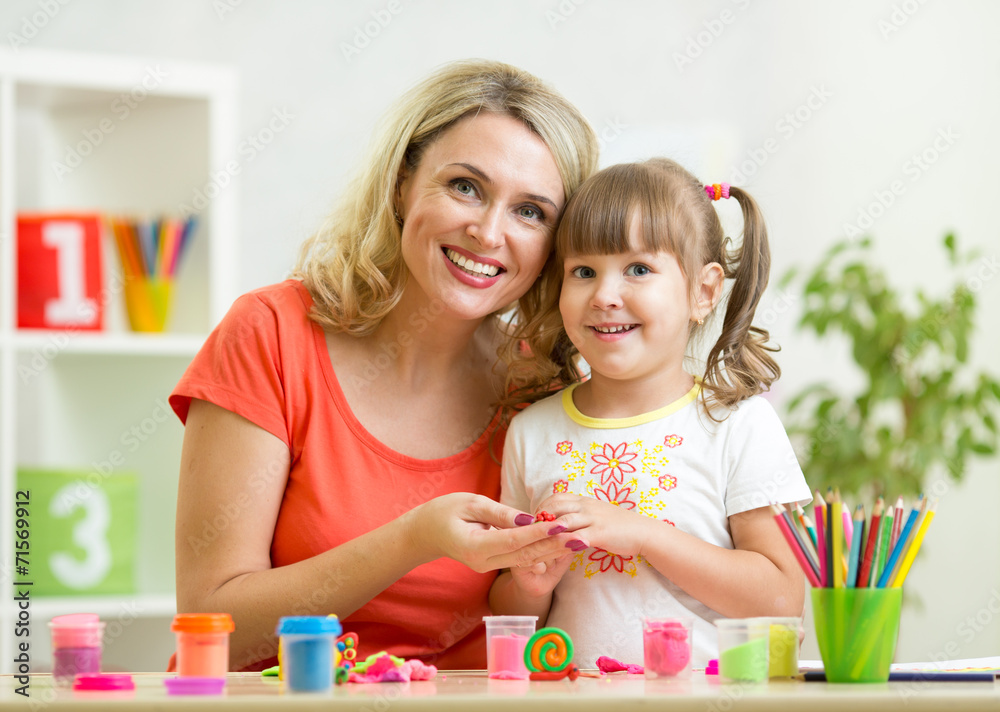 kid girl and mother playing colorful clay toy kid girl and mother playing colorful clay toy